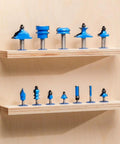 Router Bit Storage Inserts Set For 1/4 And 1/2 Inch Shank Router Bits displayed on wooden shelves