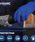 Royal Blue Nitrile Gloves 6 Mil Latex Free Raised Diamond Texture Medium gripping a power tool.