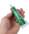 Heavy Duty RTV Silicone Adhesive 704 Rubber Glue 45g tube held in hand, suitable for electronics and machinery use, RoHS compliant.