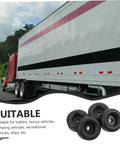 Heavy Duty Round Rubber Bumpers Anti Vibration Foot Pads For Trucks DIY Projects Furniture And Machines Black Noise Reducing Ground Protection And Shock Absorption For Heavy Equipment And Floor Safety next to a large truck on the road.
