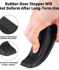 Close-up of hand holding 2 Pack Premium Rubber Door Stoppers For Bottom Of Door Security Heavy Duty Non Slip Wedges For Carpet Wood Tile Hardwood Floors Anti Scratch Quiet Durable Door Stopper Set, showcasing durability and flexibility.