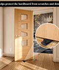 4 Pack Door Stoppers, Rubber for Bottom of Door, Rubber Door Stopper Wedge in use on wooden floor with door open