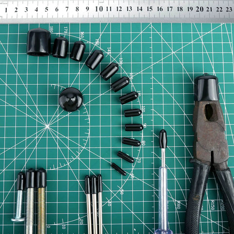 Round Rubber End Caps Set 158 Pieces With 12 Sizes on a green grid mat with tools