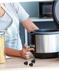 20 Pack Rubber Feet Replacement For Rice Cookers And Pressure Cookers shown next to a stainless steel rice cooker