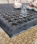 Outdoor Rubber Floor Mat With Drainage Holes Anti Slip Heavy Duty Entrance Mat showing non-slip surface and drainage capability.