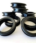 Eight-pack rubber grommets designed for 1-3/4 inch holes, featuring 1.5 inch inside diameter and 0.25 inch groove, stacked and uninstalled.