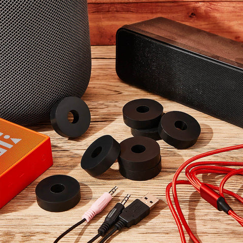 Set of 16 thick rubber isolation pads with 1.5 inch outer diameter, 0.5 inch inner hole, and 0.4 inch thickness displayed on wooden surface.