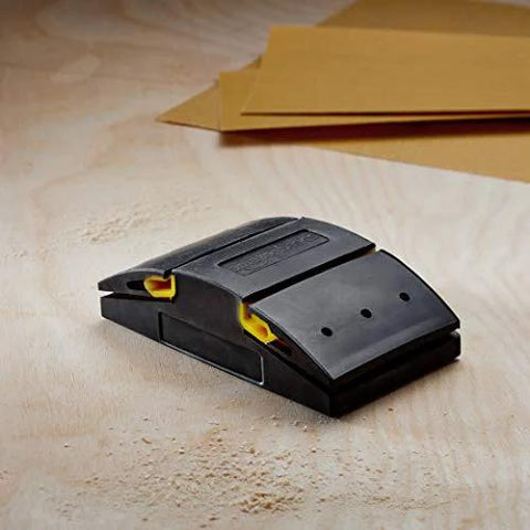 Rubber Sanding Block 5.1 Inch for wet or dry sanding fits quarter sheet shown on wooden surface with sandpaper sheets nearby