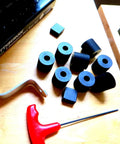 Premium 4-Pack Rubber Spacers For Anti-Vibration And Mounting, IZZY USA LLC, various spacers on a wooden surface with tools