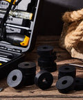 Eight piece set of thick rubber vibration isolation pads displayed with tools, showing solid damping feature for washers and appliances.