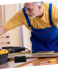 Man in workshop setting with rubber vibration isolation pad on table, used for washing machines and generators heavy duty anti vibration pad shock absorbing.
