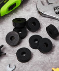 Eight piece set of thick rubber vibration isolation pads delivers solid damping for washers and appliances, absorbing impacts, reducing noise, and protecting floors. Pads shown with tools on concrete surface.