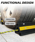 Heavy Duty Rubber Wheel Chocks For Travel Trailers Campers RVs And Cars With Nylon Rope And Yellow Reflective Tape Size Four Point Two Inches By Four Point Seven Inches By Eight Point Two Inches Nine Lbs Total Weight Two Pairs Four Pack Sturdy Tire installed behind wheel