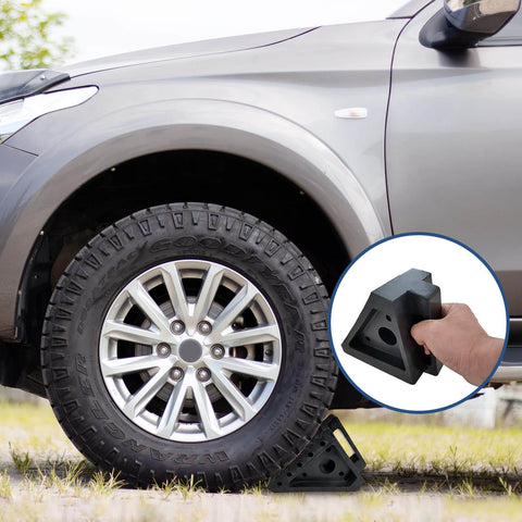 Heavy Duty Rubber Wheel Chocks Set Of 4 For Cars Trailers RVs Trucks And ATVs Premium Non Slip Tire Stoppers 8 X 4 X 6 Inches Durable Solid Rubber Black positioned under car tire