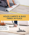 Man installing rug using Two Sided Rug Tape Heavy Duty Grip That Keeps Rugs Put, 90 Feet Long, 1.88 Inches Wide, Ultra Sticky Adhesive