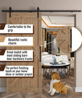 12 Inch Round Rustic Barn Door Handle Black Steel Pull installed on wooden sliding door in living room setup