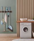 Rustic Wood Wall Mount Mop And Broom Organizer With 4 Slots And 4 Hooks in laundry room holding cleaning tools