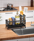Compact rustproof 304 stainless steel sink caddy with a rotatable spout and tall brush holder on a kitchen counter.