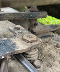 Close-up of metal machinery with dirt showing a part compatible with 80 Piece SAE Grease Fittings Set With Common 1/8 NPT And 1/4-28 Threads