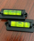 Two acrylic bubble levels with mounting holes, part of the 4-Piece RV Bubble Spirit Level Set With Mounting Holes For RV Camper Travel Trailer Truck And Motorhome, Easy Install Leveling Tool To Level Your Rig On Any Road Trip