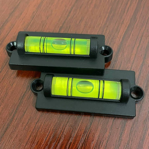 Two acrylic bubble levels with mounting holes, part of the 4-Piece RV Bubble Spirit Level Set With Mounting Holes For RV Camper Travel Trailer Truck And Motorhome, Easy Install Leveling Tool To Level Your Rig On Any Road Trip