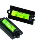 All Purpose RV Levelers For Front To Back And Side To Side Leveling That Keeps Your Camper Super Stable And Level With Easy Install Using Screws Or Adhesive Tape Plus Bubble EasyView Display 2 Pack PerfectAxis System By Camco shown with bubble displays, highlighting the leveling functionality.