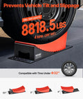 Heavy Duty RV Leveling Blocks Set For Campers And Trailers 2 Pack Up To 8818.5 Lbs Support 4 Inch Max Height Curved Design With Anti Slip Mat Carrying Bag And Wheel Chocks Dual Axle Ready Stable On Uneven Ground shown in use under tire.