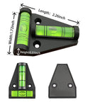 Black and green spirit level with measurements for length and width, featuring two bubble vials and mounting holes on a triangular base.