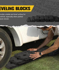 Man installing 3 In 1 RV Leveling Blocks Set For Camper And Trailer Stackable Jack Blocks Interlocking Recovery Boards And Wheel Stabilizers 10 Pack With Carry Bag Black
