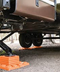 Interlocking RV Leveling Blocks 10 Pack With Nylon Storage Bag For Trailer Motorhome And Vanlife Up To 40,000 Lbs Capacity Orange Made In USA By Tri-Lynx Lynx Levelers Durable Heavy Duty Stability For Uneven Terrain And Easy Quick Leveling under RV