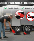 Heavy Duty RV Leveling Blocks for Travel Trailers With Anti Slip Mats and Chocks, 2 Pack Includes Carry Bag, 4 Inch Max Leveling Height, Works Up To 35000 Lbs GVW, Red by ROBLOCK shown in use under trailer tires.