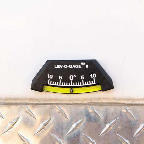 Lev O Gage II RV Leveling System 2 Pack Made In USA High Visibility Brass Ball Level For RV Camper And Pop Up Trailer No Bubble Tilt Readings From Minus Ten To Plus Ten Degrees Sun Company mounted on metal surface