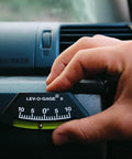 Hand adjusting Lev O Gage II RV Leveling System 2 Pack Made In USA High Visibility Brass Ball Level For RV Camper And Pop Up Trailer No Bubble Tilt Readings From Minus Ten To Plus Ten Degrees Sun Company inside vehicle