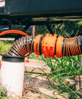 3 In 1 RV Sewer Hose Adapter And Drain Seal With RhinoExtreme Hose And Handle connected to a 4-inch inlet at campground.
