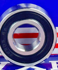 S6203-2RS Stainless Steel Hybrid Bearing 17x40x12mm Ceramic Balls Sealed Bearing side view with rubber seal and shiny metal.