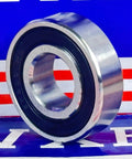 S6203-2RS Stainless Steel Hybrid Bearing 17x40x12mm Ceramic Balls Sealed Bearing side view on a blue background.