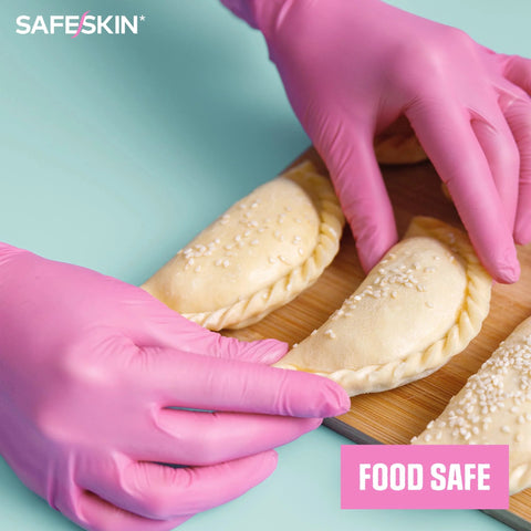 Person wearing Ultralight Nitrile Gloves 2.0 Mil Powder Free Latex Free Magenta X Large 100 handling dough.