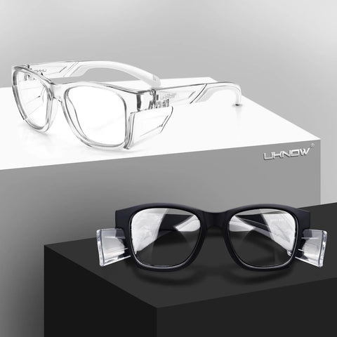 Safety Glasses With Anti Fog Lenses And Shields ANSI Z87 1 UV Protection, clear and black styles displayed on pedestals