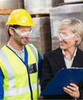 Workers wearing 48 Pack Safety Glasses Clear Protective Eyewear For Work Lab Lightweight Comfort, discussing in a warehouse.