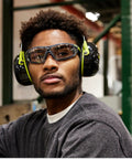 Man wearing Safety Glasses With Removable Foam Gasket TruShield Anti Fog Adjustable Fit and earmuffs in workshop.