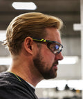 Man wearing Safety Glasses With Removable Foam Gasket TruShield Anti Fog Adjustable Fit in warehouse setting