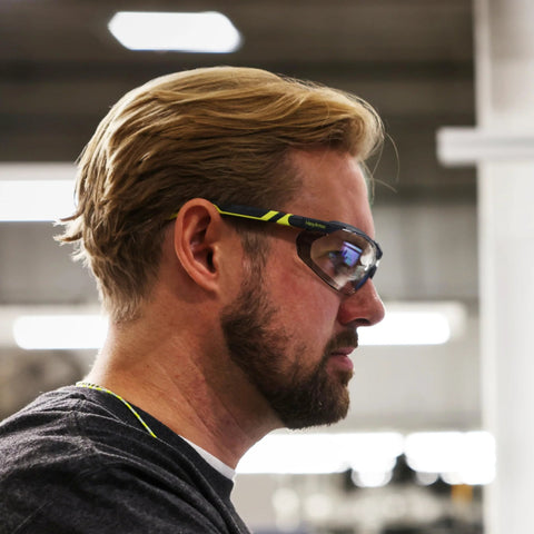 Man wearing Safety Glasses With Removable Foam Gasket TruShield Anti Fog Adjustable Fit in warehouse setting
