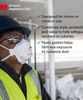 Construction worker wearing Virtua CCS Clear safety glasses with foam gasket and face mask on a jobsite.