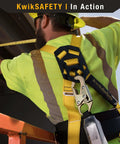 Worker wearing Taipan 6 Foot Double Leg Flat Safety Lanyard with External Shock Absorber during construction.
