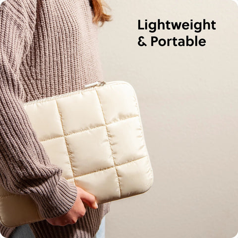 Person holding Nylon Puffy Zipping Laptop Sleeve 9.75 By 13 Inches Fits Most Screens Up To 14 Inches With Plush Lining, Sand Beige