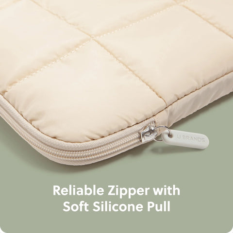 Close-up of sand beige Nylon Puffy Zipping Laptop Sleeve with plush lining and reliable zipper, fits 14-inch screens.
