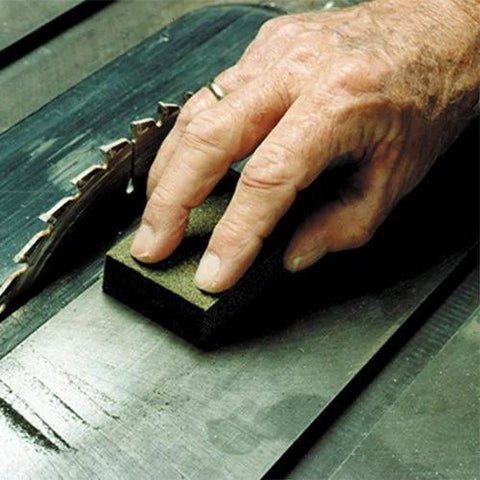 Person using Sanding Block 3 Pack With Fine Medium Coarse Grits Shaping And Rust Removal on metal surface near saw blade
