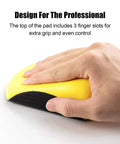 Hand holding 5 Inch Hook And Loop Mouse Sanding Block 2 Pack for Woodworking and Furniture with finger slots for grip.