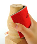 Hand using 24 Piece Sanding Sponge Set 180 To 3000 Grit Foam Hand Sander 3x4in Wet Dry on wooden surface