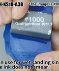 Close-up of Sanding Sponge Set 34P 10mm Thick Wet Dry Assorted Grits 120 To 10000 for Models in use on blue surface.